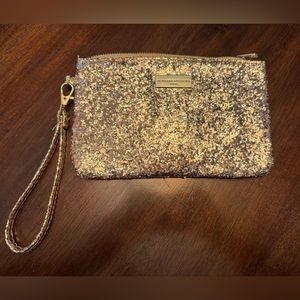 Adrienne Vittadini gold glitter wristlet with charging bank
